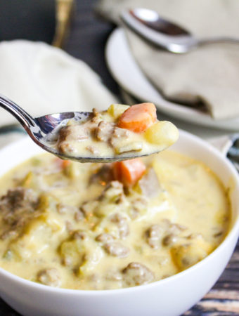 cheeseburger soup in a white bowl