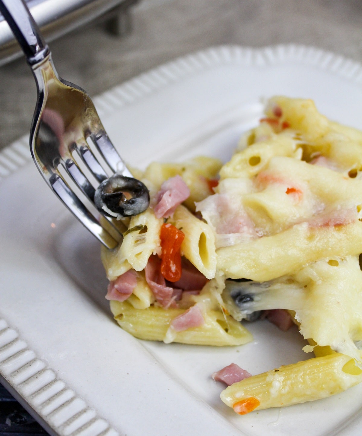 muffaletta casserole on a fork