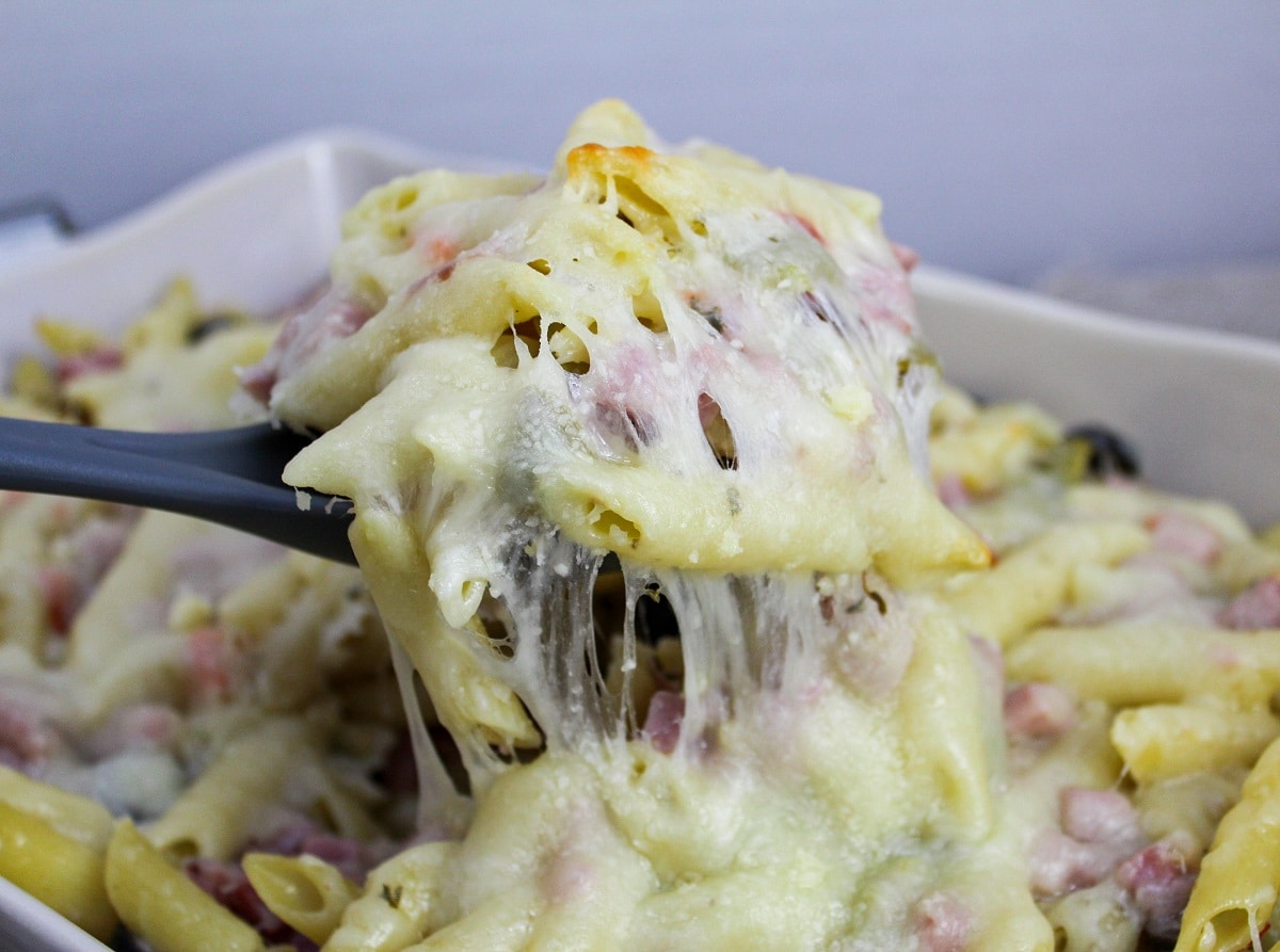 muffaletta casserole scooped from baking dish