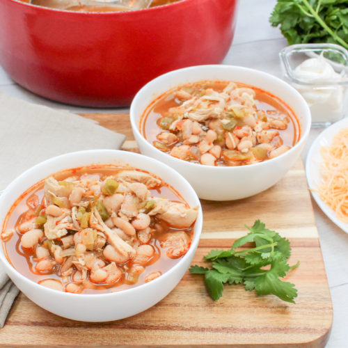 chicken, beans, and pepper soup in a white bowl