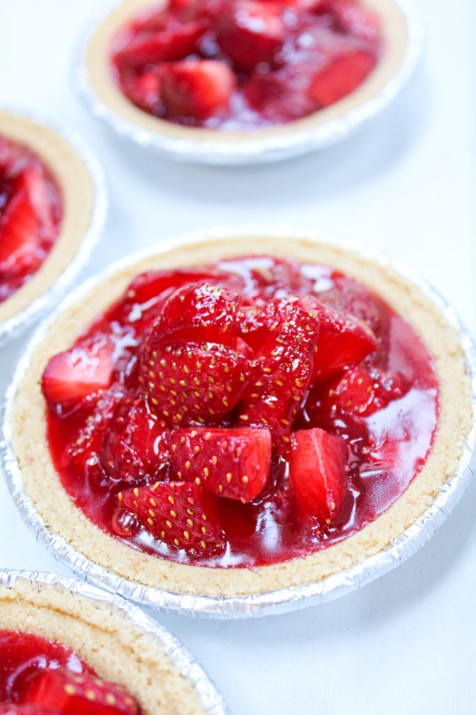 mini strawberry pies on a platter