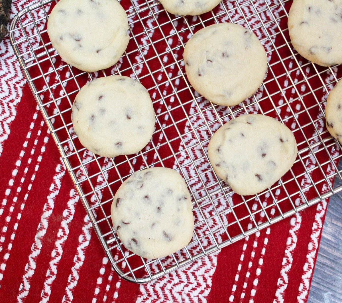 whipped chocolate chip shortbread cookies on a cooling wrack