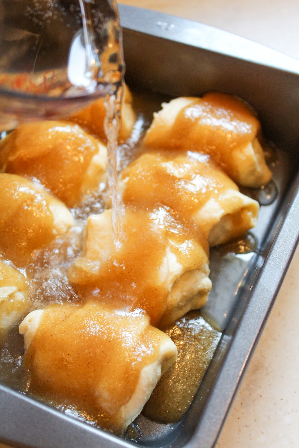 white soda poured on uncooked dumplings