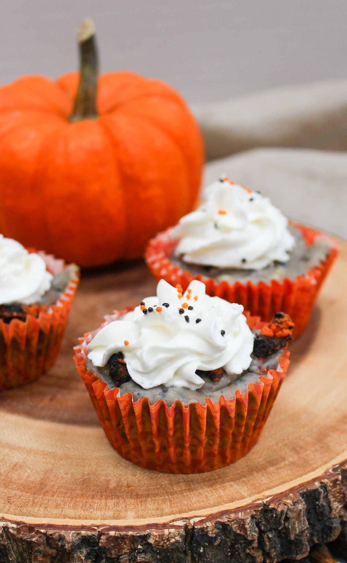 Mini Halloween Oreo Cheesecakes in orange wrappers