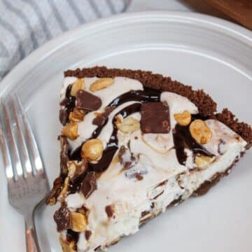 Snickers Ice Cream Cake plated on a white dish.