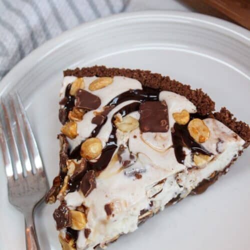 Snickers Ice Cream Cake plated on a white dish.