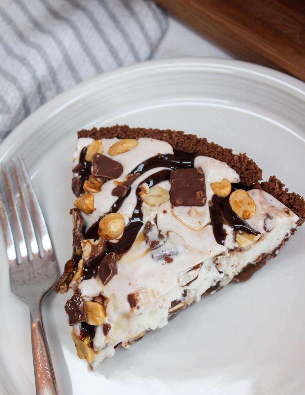 Snickers Ice Cream Cake plated on a white dish.